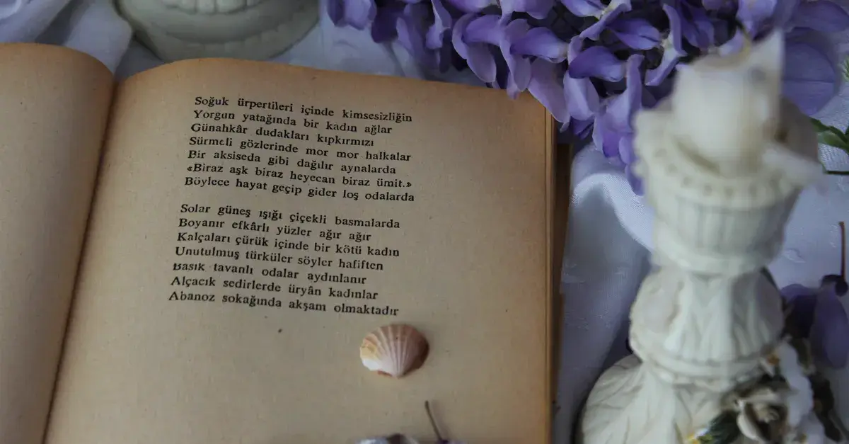 An open vintage book with poetry surrounded by purple flowers and seashells.