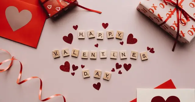 Celebratory Valentine's Day decor with gifts, hearts, and love notes.