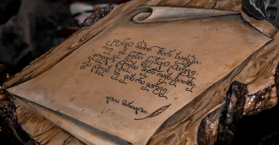 High angle of old lacquered woodwork with image of parchment and old inscriptions